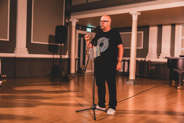 Professional Event MC Kalle Ryan presenting on-stage live at WYA 25th anniversary gala showcase